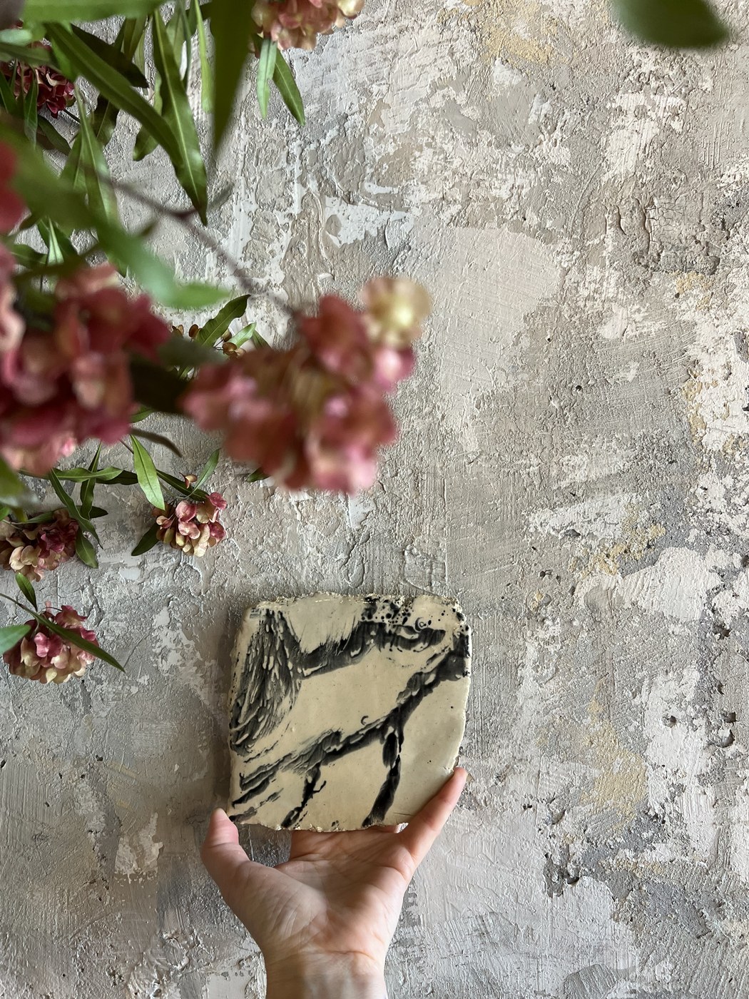 Hand-painted ceramic tile, wing motif
