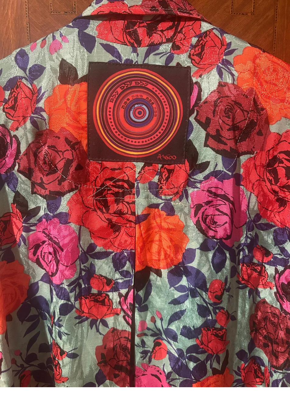 Mandala patch on a printed rose-pattern shirt